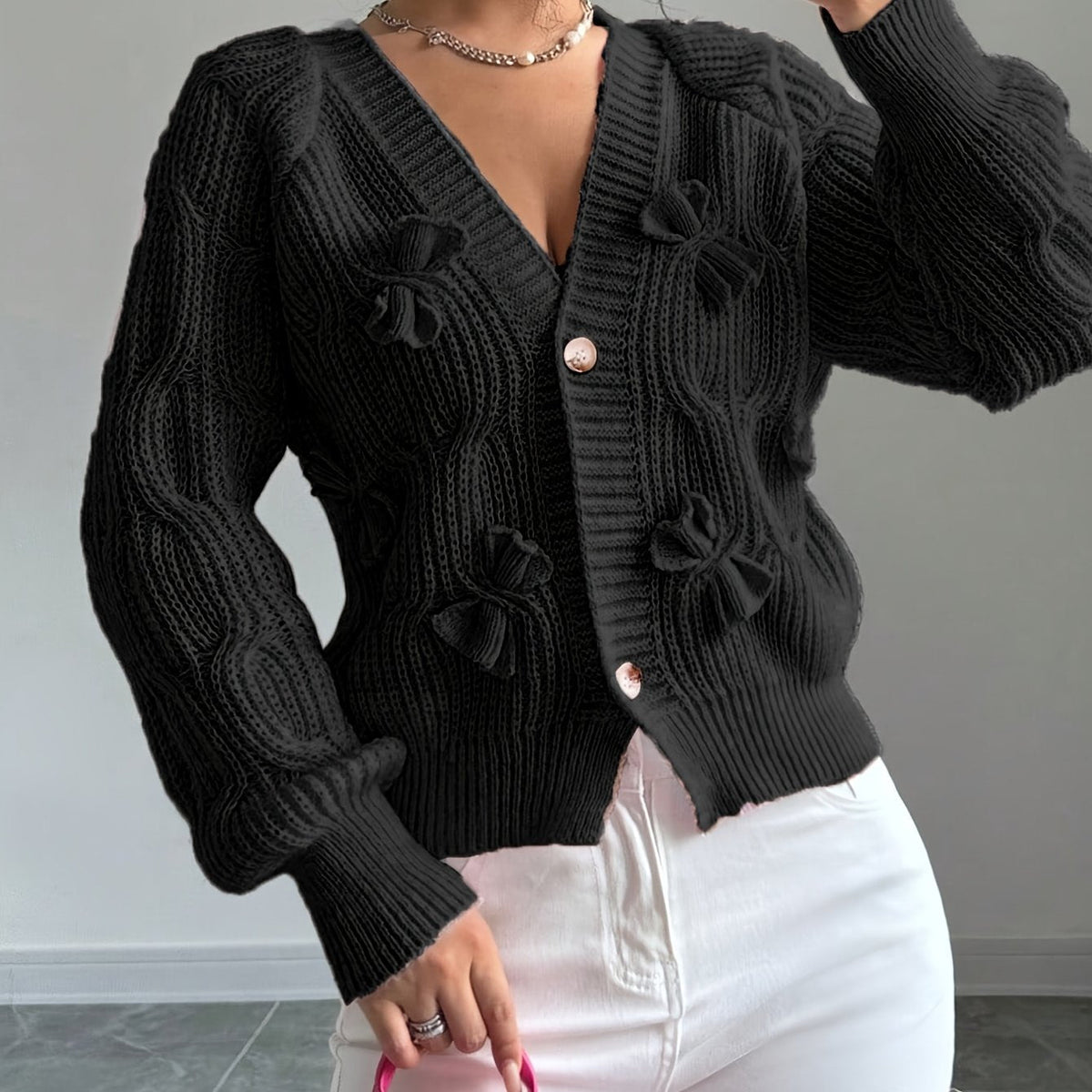 Perpetua – Bow-Detail Cable-Knit Cardigan